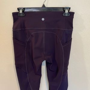 Women’s Lululemon full length leggings. Dark purple. Two side pockets.